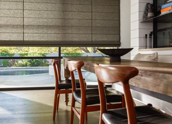 the-shade-store-cascade-woven-wood-shades-dakota-charcoal-woven-wood-cascade-woven-wood-shades-large-windows-wood-dining-table-hero-image-2015-600x435