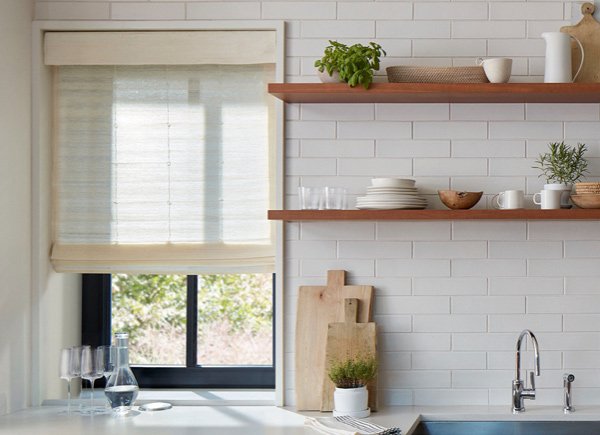the-shade-store-standard-woven-wood-shades-coastline-muslin-woven-wood-woven-wood-shades-over-kitchen-window-wood-shelves-hero-image-2021-madison-600x435